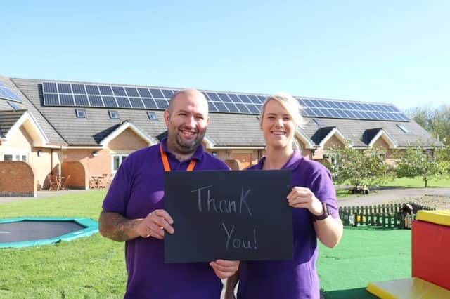 Care team members Lee Bartrop and Charlotte Firth offering a big "thank you" to mystery supporters.