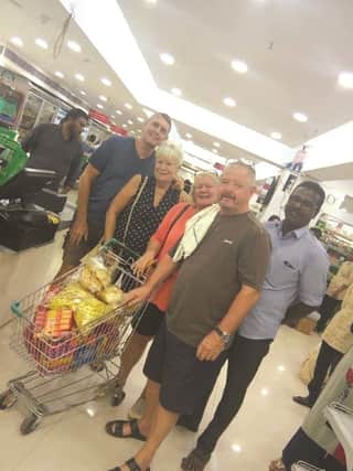 Sue and Paul Nortcliff (centre) with friends Judy and Robert Hayes (left), who have been helping with the relief effort, and their rickshaw driver Raj Mohan