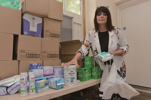 Food parcels and kids activity packs have been packed and delivered to families across the borough, by volunteers working from Swinton Lock. Swinton Lock manager Jayne Senior is pictured packing baby supplies.