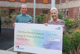Ben Maxfield and Allison Fox, senior travel consultants at Maxfields Travel, presenting their cheque to the Rotherham Hospital and Community Charity.