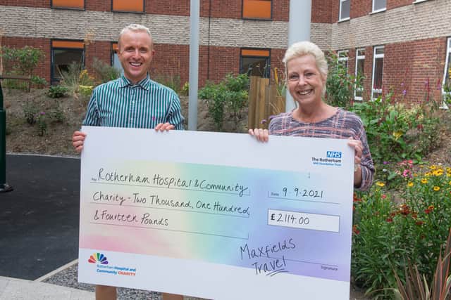 Ben Maxfield and Allison Fox, senior travel consultants at Maxfields Travel, presenting their cheque to the Rotherham Hospital and Community Charity.