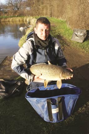 GARY WEEKES with a 14lbs carp, part of his winning catch on Sunday at Lowfield Lakes.

