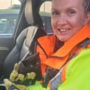 Emma Newell and the kitten rescued from the M1