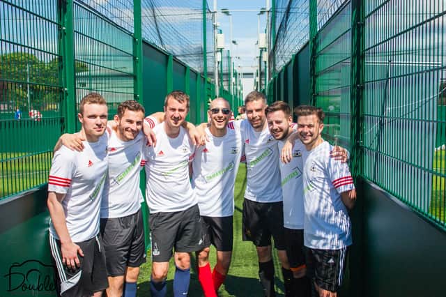Dmitry (centre) with one of the teams that played in the charity tournament
