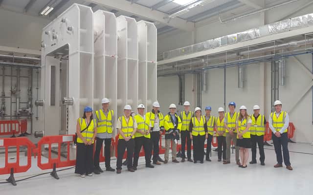 Members of the Lighweighting Excellence programme, which includes the AMRC Composite Centre, at the site of the new press