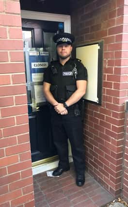 PC Lee Smith issues the closure order at the property on Robert Street