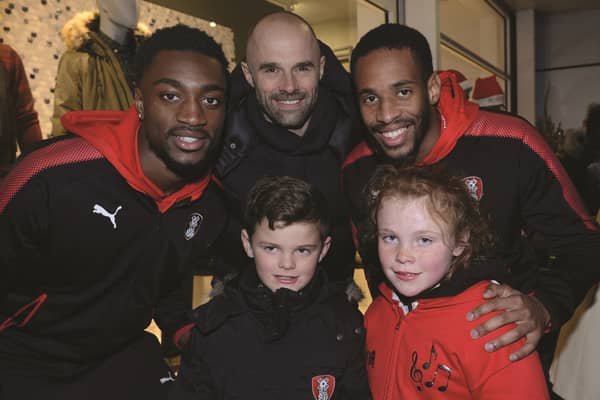 Thurcroft youngsters Charlie and Olivia Wright met Rotherham United manager Paul Warne and players Semi Ajayi (left) and Shaun Cummings at the launch of the annual Christmas toy appeal at Parkgate recently.171925-4