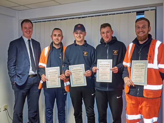 Caption (from left): Council leader Cllr Chris Read with Ryan, Alex, Ollie and Christopher, holding their recently awarded training certificates