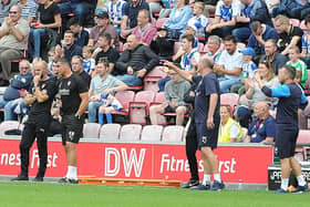 Paul Warne and assistant manager Richie Barker on duty at Wigan. Pictures: DAVE POUCHER