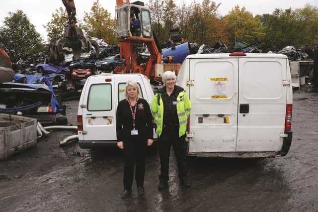 PC Beverley Frisby and Nicola Dagnall, case management officer for the Barnsley Metropolitan Borough Council, Safer Neighbourhood Service with the two vans. 184412-2