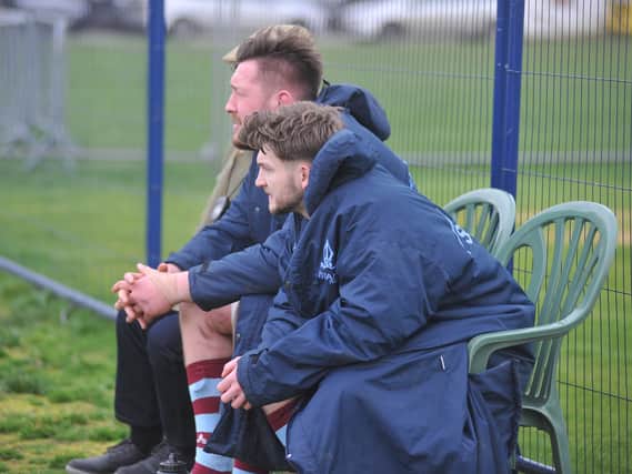 Dan Preston-Routledge and Tom Benjamin watch the action after being yellow carded at Clifton Lane on Saturday.