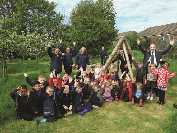 Pupils and staff at Meadow View Primary School, Kimberworth, are seen celebrating recently at the opening of their new forest area