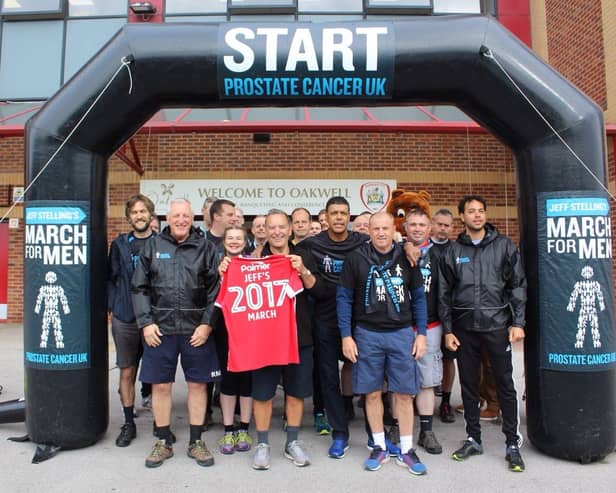Ronnie Moore, Jeff Stelling, Chris Kamara and Paul Jewell, pictured front row (left to right), with the rest of the team who completed the walk at Barnsley’s Oakwell stadium .