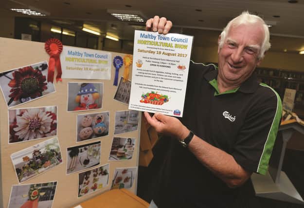 Steve Bray, member of the organising committee for Maltby Town Council's upcoming Horticultural Show with a poster promoting the event. 171263