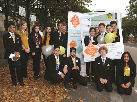 Oakwood High School pupils joined other pupils across Rotherham in wearing yellow today to mark World Mental Health Day and launch the STILL campaign (Stop, Think, take Interest, Listen and live Life). Y7 to Y11 pupils are seen at the launch of the campaign. 171734-3