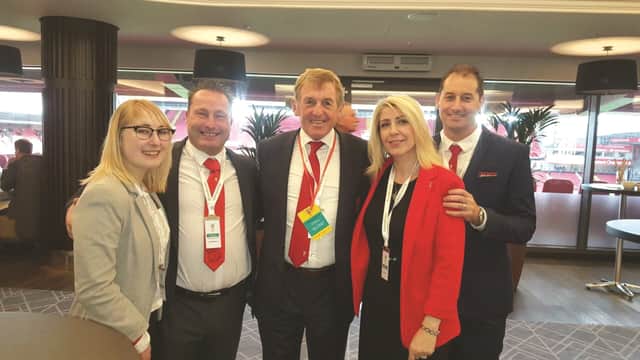 Curtis' family pictured with former Liverpool player and manager Kenny Dalglish (centre)