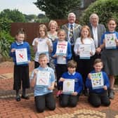 The Mayoress of Rotherham, Mrs Sandra Buckley (back row, left), the Mayor of Rotherham, Cllr Alan Buckley (back row, centre) and cabinet member for adult social care and public health, Cllr David Roche (back row, right) with the winning pupils.