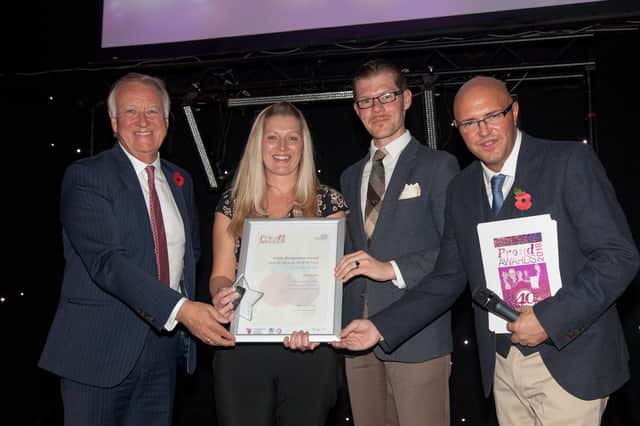 Trust chairman Martin Havenhand (L), Heart DJ Dixie (R) and Advertiser health reporter Dave Doyle present Kelly Guest with her award.
