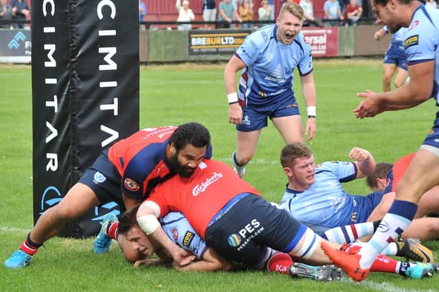 Ben Robbins goes over for Rotherham's first try against Sale FC.
