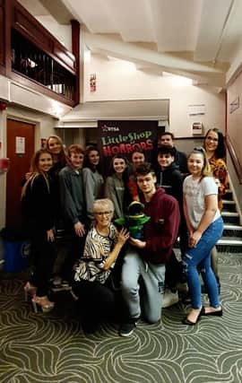 Sam (centre right) with one of his creations and members of the "Little Shop" cast and crew