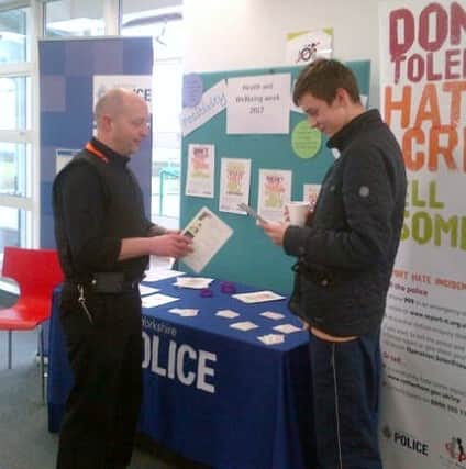PCSO Neil Entwhistle speaks to a student about hate crime.