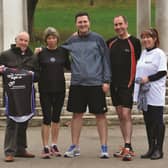 (Pictured from left to right), Ray Matthews, Wendy Whitaker, Rotherham Harriers, Sam Cooper and Andrew Mosley, Rotherham, Advertiser and Julie Benson, fundraising co-ordinator for Age UK Rotherham. 170397-1