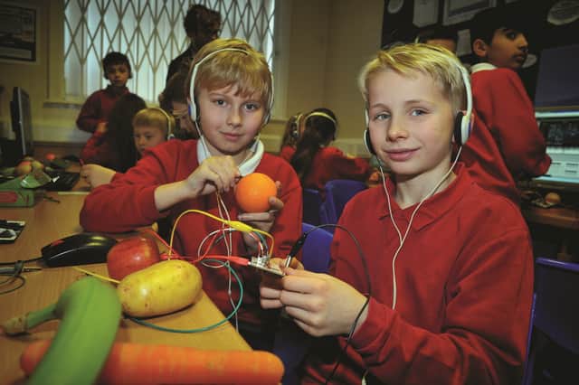 Pupil's from Ravenfield Primary Academy who took part in a hi-tech electronics workshop on Friday where they were given the chance to make music using circuit boards and everyday fruit and vegetables. Pictured are Jake Parker(right) and George Parkin. 180214-2