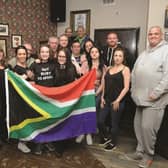 Ruby is seen with her mum Rebecca Stanley, who is Bar Manager at The County pub, with staff and regulars who are organising fundraising events to help get Ruby to Africa. 180605-2
