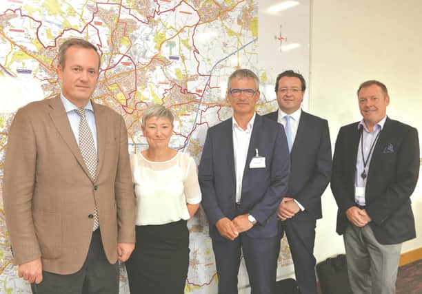 Rotherham Borough Council's strategic director of regeneration Damien Wilson (right) and cabinet member for jobs and local economy Denise Lelliott are pictured with (from left to right) chief executive of United Caps Benoit Henckes, chief project officer Rony Van Regnmortel and plant director Paul Gorry.