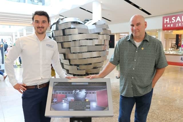 The AMRC’s Michael Lewis and sculptor Steve Mehdi try out the Heart of Steel app