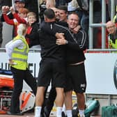 Paul Warne and his staff celebrate Saturday's win against Derby.