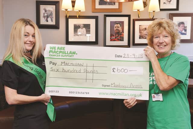 The Montagu Arms at Mexborough has raised £600, the proceeds of various recent fundraising events, for Macmillan. Event organiser Andrea Oliver (left) is seen handing over the cheque to chairman of the Swinton and Mexborough committee of Macmillan Cancer Support Pat Robinson. 184349