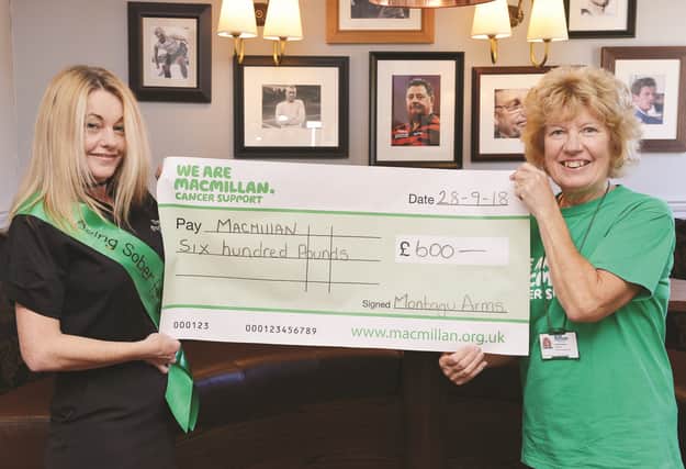 The Montagu Arms at Mexborough has raised £600, the proceeds of various recent fundraising events, for Macmillan. Event organiser Andrea Oliver (left) is seen handing over the cheque to chairman of the Swinton and Mexborough committee of Macmillan Cancer Support Pat Robinson. 184349