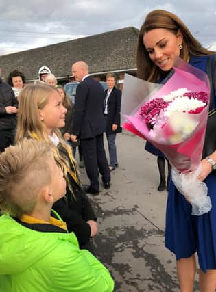 Ellie and Oliver present the Duchess of Cambridge with a bouquet