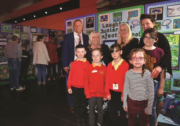 Head of education for Rotherham Schools Improvement Service and one of the exhibition organisers, Del Rew, is pictured with special guests the Mayor and Mayoress of Rotherham, Cllr Jenny Andrews and Cllr Jeanette Mallinder, visitors and some of the pupils who have work on show.

