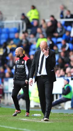 Paul Warne and Reading boss Jaap Stam on the touchline