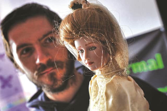 Lee Steer pictured with Christine the doll