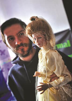 Lee Steer pictured with Christine the doll