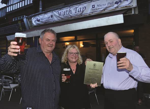 The Wath Tap micro pub on High Street at Wath, was named 2017 Pub of the Year by the Rotherham branch of CAMRA (Campaign for Real Ale). Regional director for CAMRA Kevin Keaveny (right) handed over the award to landlord Roy Lomax and landlady Mel Swanwick. 171420