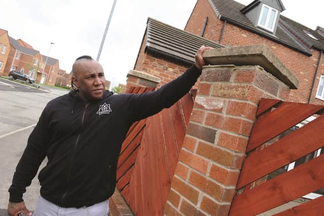 Ras Armstrong showing a wobbly wall in Goldthorpe which he has raised concerns about.
