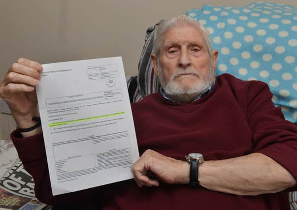 James Connelly who was banned from Denaby and Cadeby Miners' Welfare Club pictured with the court order.
