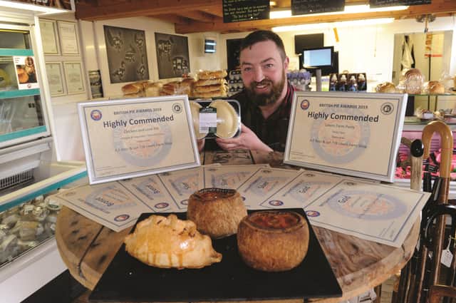 Anthony Ross with some of his award winning pies. 190513-3