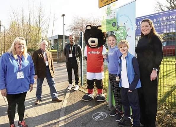 Pictured at the Beat Box outside Thrybergh Fullerton School are, from left to right: Beat the Street engagement co-ordinator Ivy Dorchester-Brown, marathon man Ray Matthews, engagement co-ordinator Nadeem Sham, Rotherham United mascot Miller Bear, Thrybergh Fullerton School pupils Evie Wilson and Lucas Moorcroft and head teacher Hannah Lambert.