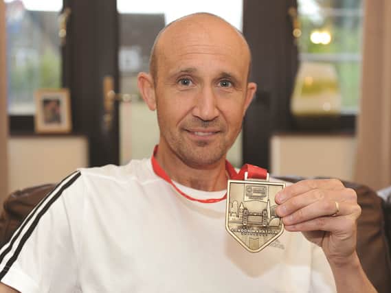 Seen at his North Anston home is Richard Harris, who recently completed the 2017 London Marathon. Towards the end of the race his legs gave way and he was helped up by two fellow runners and sent on his way. 170691-3