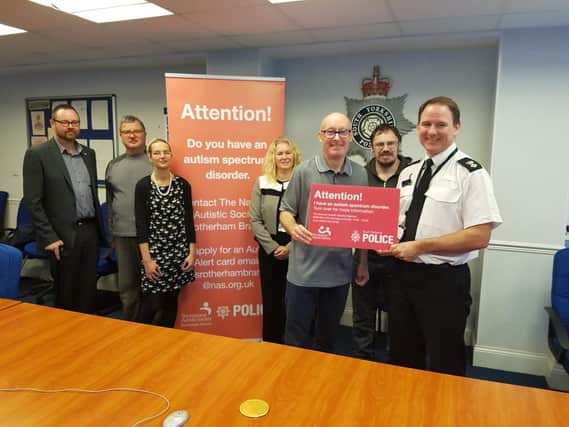 Ch Supt Rob Odell with members of the National Autistic Society.