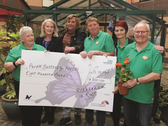 Receiving the cheque (second left) is Gabrielle Atmarow, chair of the Purple Butterfly Appeal, from (left to right) Sally Moffett, Andy Gooding, Alistair Hammond, Sarah Hague and Kieth Dodson, members of Rotherham In Root and volunteers for the NHS Rotherham Foundation Trust. 171748