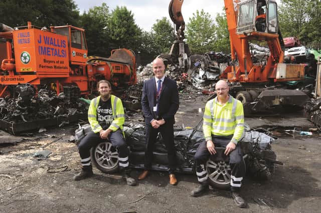 Pictured is Service Manager for Barnsley Council's Safer Neighbourhoods Service, Mark Giles along with members of the fly tipping clean up team, Dan Gaskin (left) and Murray Kemp. 184180-7