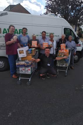 Left to right: Mexborough Foodbank volunteers John Tinsley, Paul Harrison, Penny Cliff, Mark Dockerty and Mexborough Lions members Genny New, Joan Nairn and Ronnie Nairn with (front) foodbank manager Sean Gibbons.