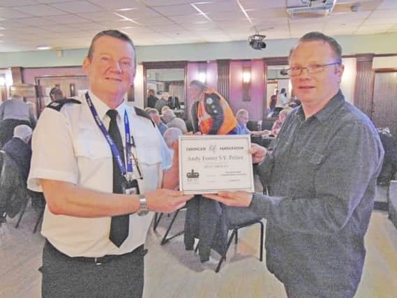 Pictured is Andy Foster receiving a certificate of participation from Chris Watson from the MCVC.