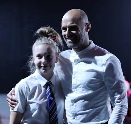 Year 10 student Mia Finnie with Millers manager Paul Warne